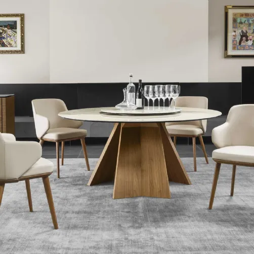 Tavolo rotondo con piano in ceramica e basamento in legno Icaro di Calligaris